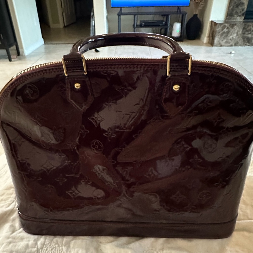 Authentic Louis Vuitton Vernis Alma PM Rouge Tote Bag.